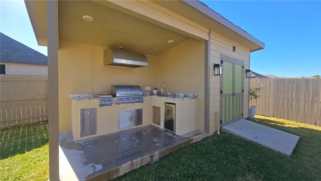 a kitchen with a stove and a microwave