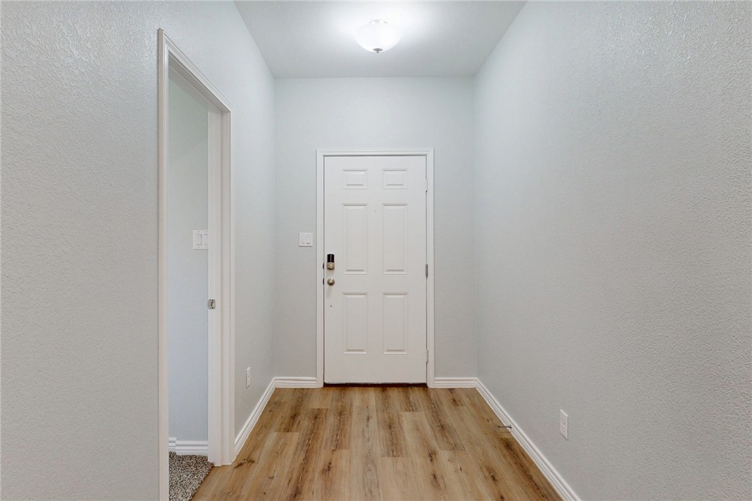 2029 Rock Rdg Avenue Bryan, TX 77807 - Photo 4 of 31 a view of a room with wooden floor and a window