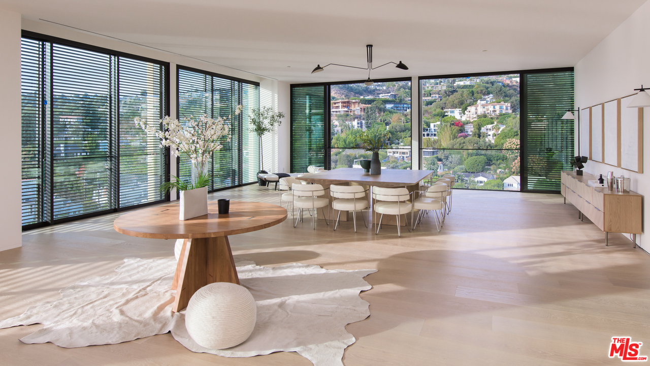 9040 Sunset Boulevard, Unit PHA West Hollywood, CA 90069 - Photo 11 of 25 a living room with large windows and furniture