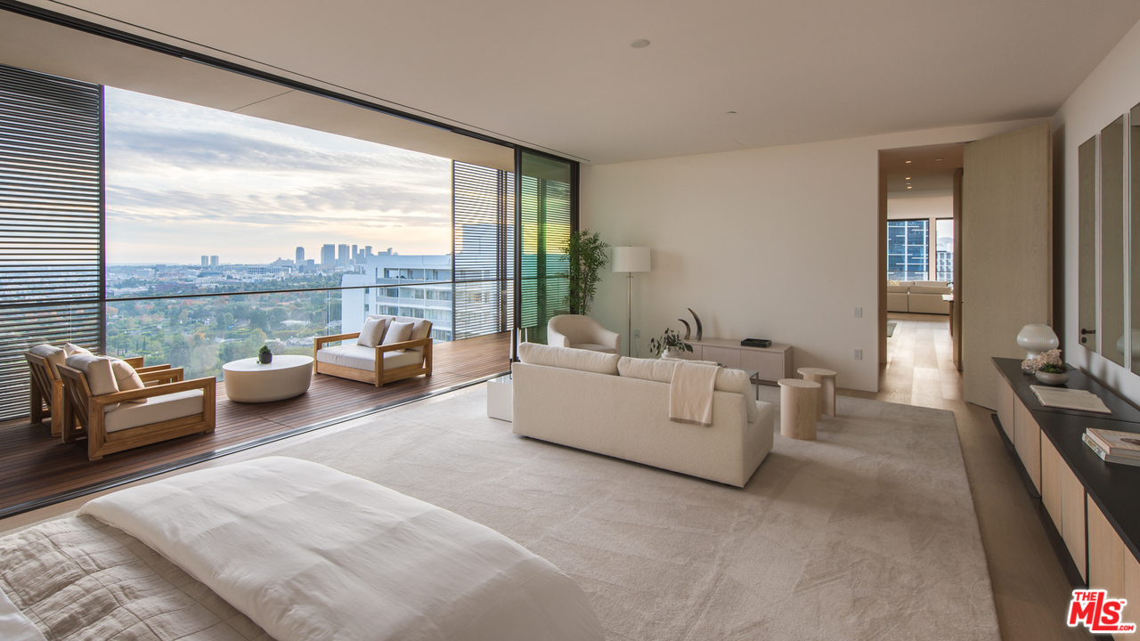 9040 Sunset Boulevard, Unit PHA West Hollywood, CA 90069 - Photo 19 of 25 a living room with furniture and a floor to ceiling window