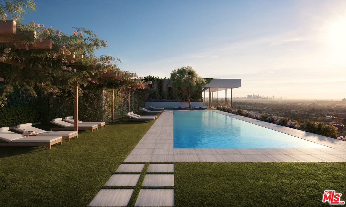 9040 Sunset Boulevard, Unit PHA West Hollywood, CA 90069 - Photo 22 of 25 a view of a swimming pool with lounge chairs