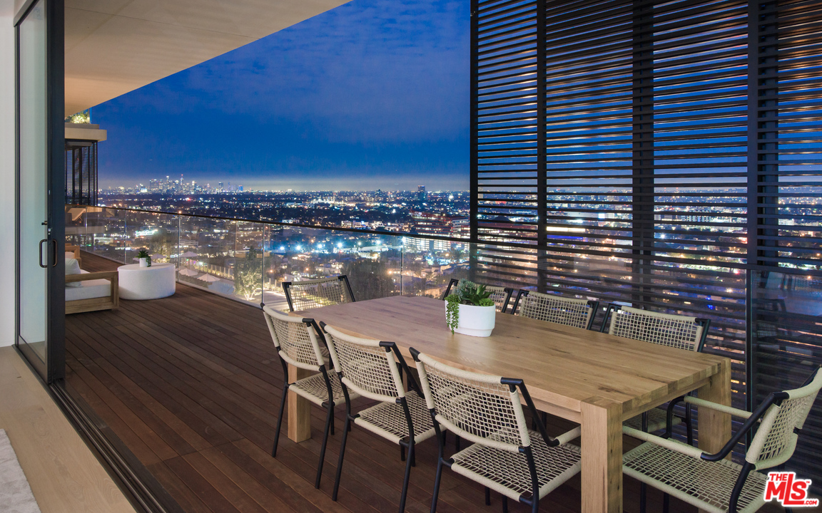 9040 Sunset Boulevard, Unit PHA West Hollywood, CA 90069 - Photo 7 of 25 a view of city from balcony with seating space