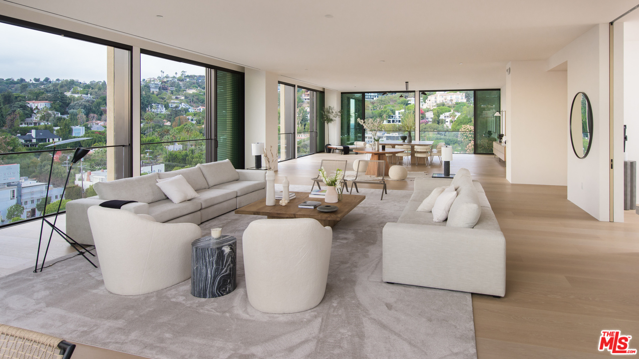 9040 Sunset Boulevard, Unit PHA West Hollywood, CA 90069 - Photo 10 of 25 a living room with fireplace furniture and a large window