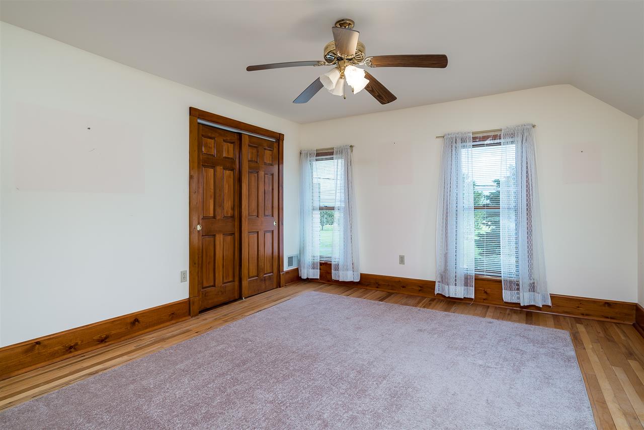 16602 Wyman School Road Caledonia, IL 61011 - Photo 20 of 25 an empty room with chandelier fan