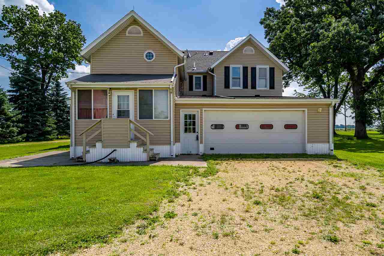16602 Wyman School Road Caledonia, IL 61011 - Photo 4 of 25 a front view of a house with a yard