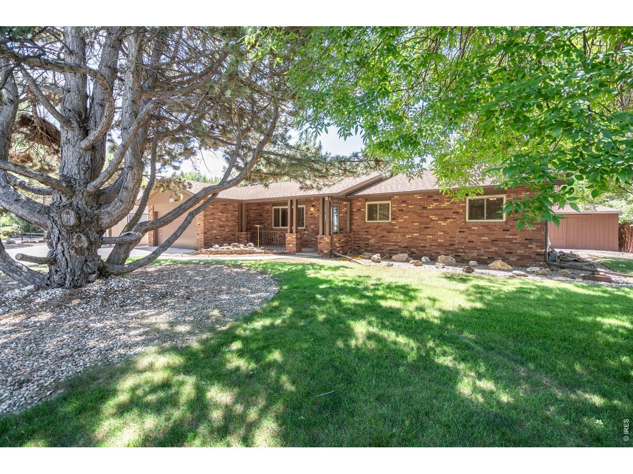 300 Ranch Acres Drive Loveland, CO 80538 - Photo 3 of 38 a view of house with a yard