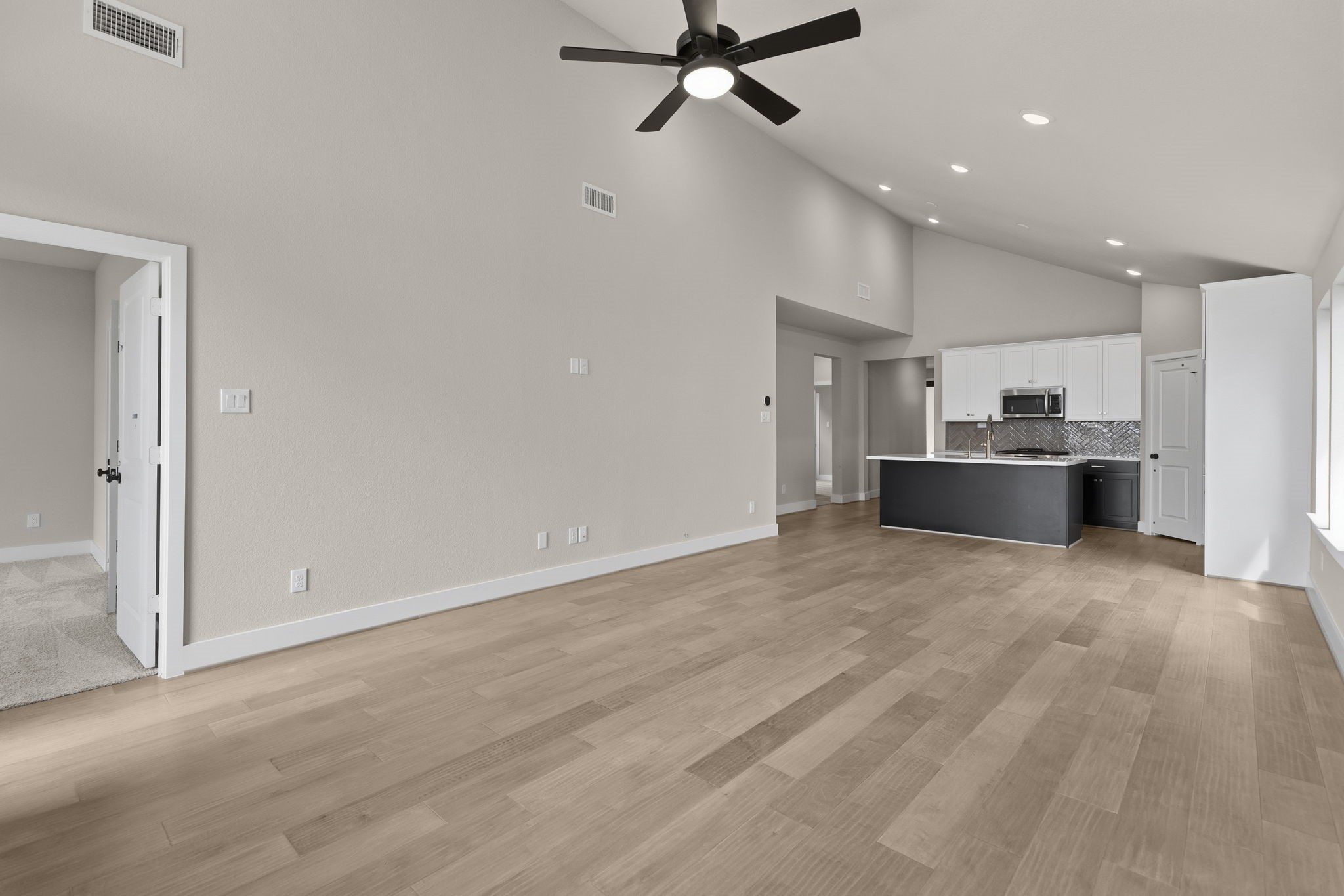 5210 Getty Lane Iowa Colony, TX 77578 - Photo 12 of 34 a view of a kitchen with a sink and a refrigerator