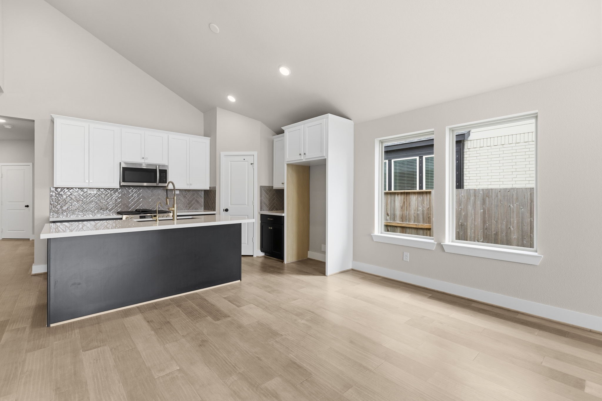 5210 Getty Lane Iowa Colony, TX 77578 - Photo 13 of 34 a large kitchen with cabinets