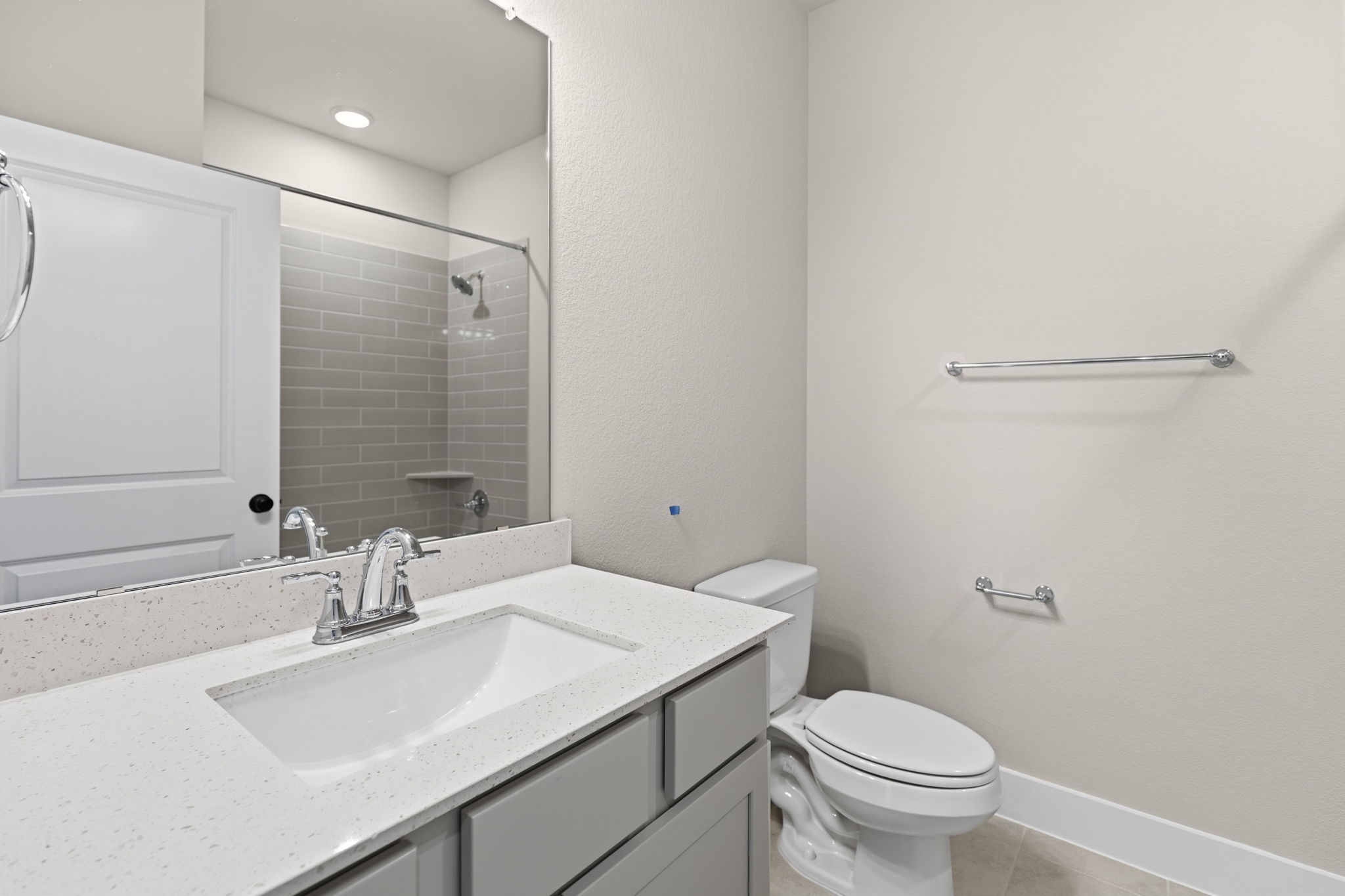 5210 Getty Lane Iowa Colony, TX 77578 - Photo 21 of 34 a bathroom with a sink toilet and vanity