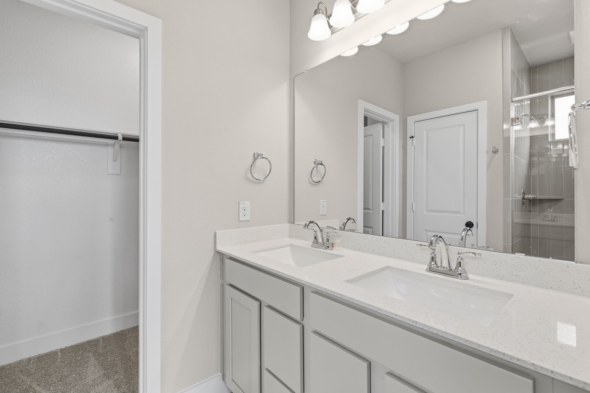 5210 Getty Lane Iowa Colony, TX 77578 - Photo 26 of 34 a bathroom with a sink and a mirror