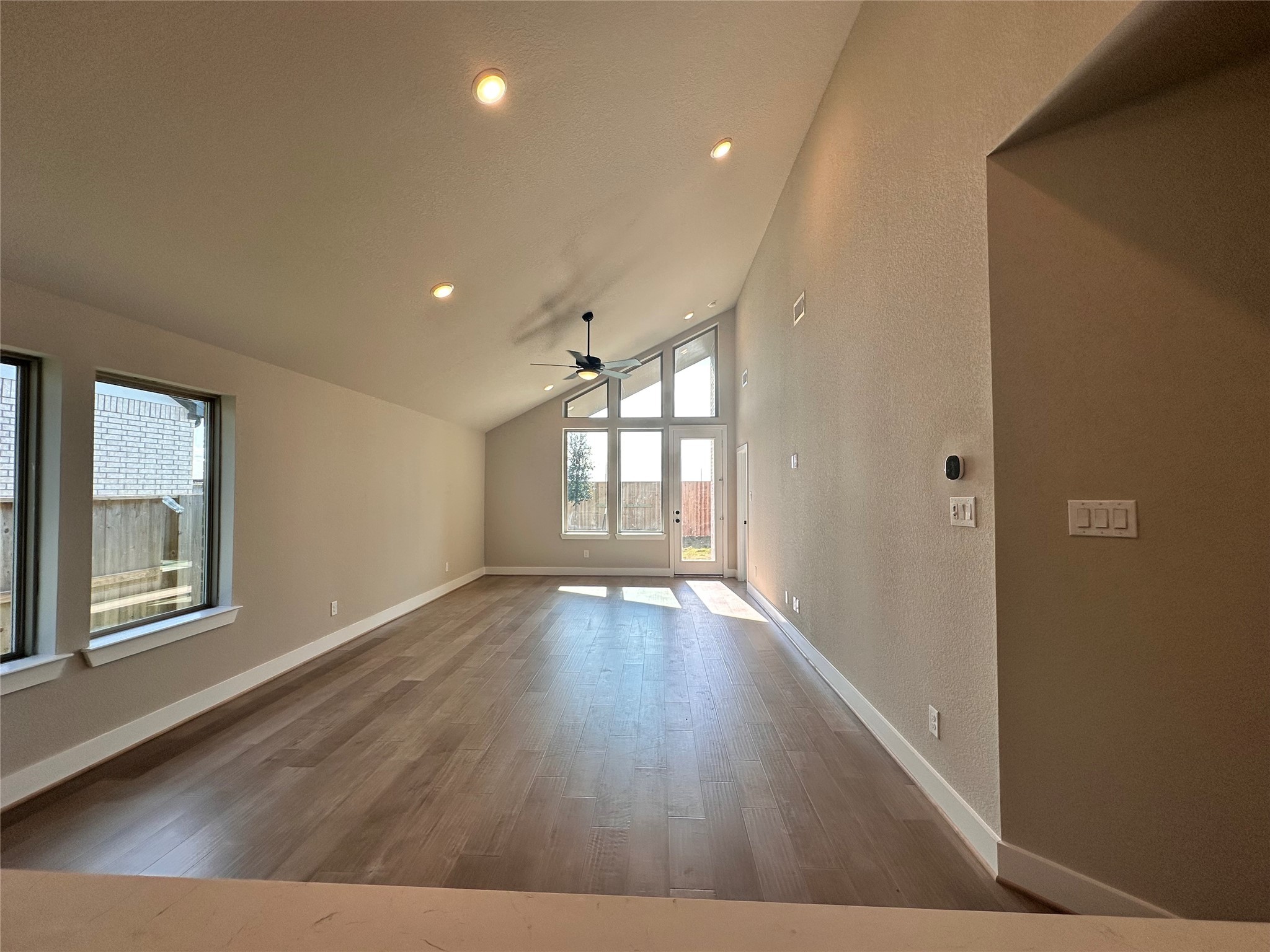 5210 Getty Lane Iowa Colony, TX 77578 - Photo 5 of 30 a view of an empty room with wooden floor and a window