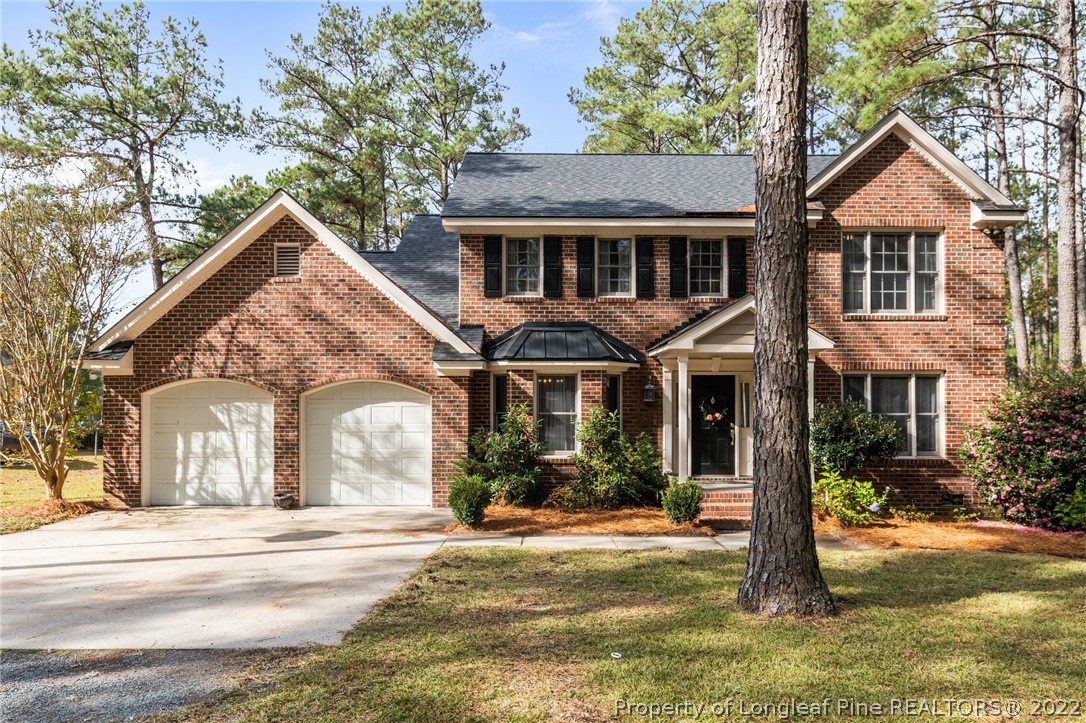 30480 East Lake Road Wagram, NC 28396 - Photo 1 of 49 a front view of a house with a yard