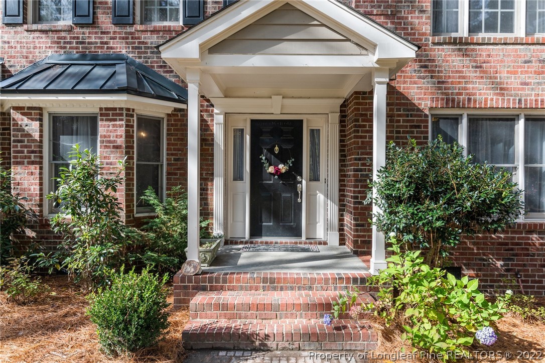 30480 East Lake Road Wagram, NC 28396 - Photo 2 of 49 front view of a house with potted plants