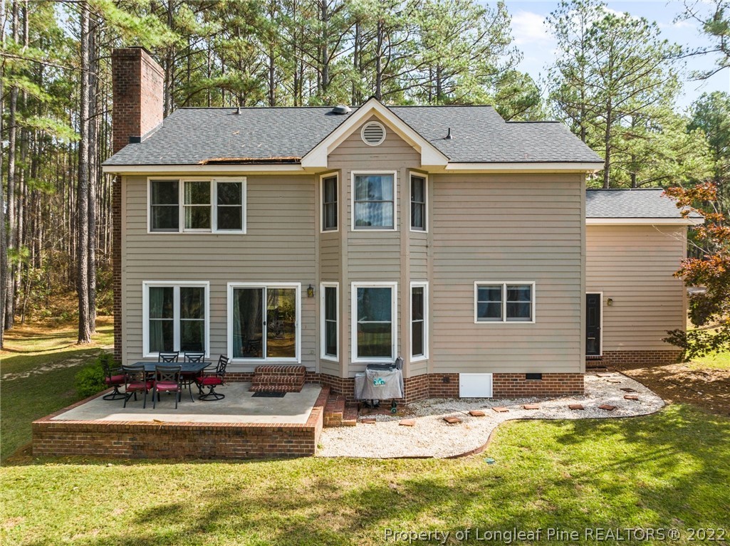 30480 East Lake Road Wagram, NC 28396 - Photo 3 of 49 a front view of a house with swimming pool and porch
