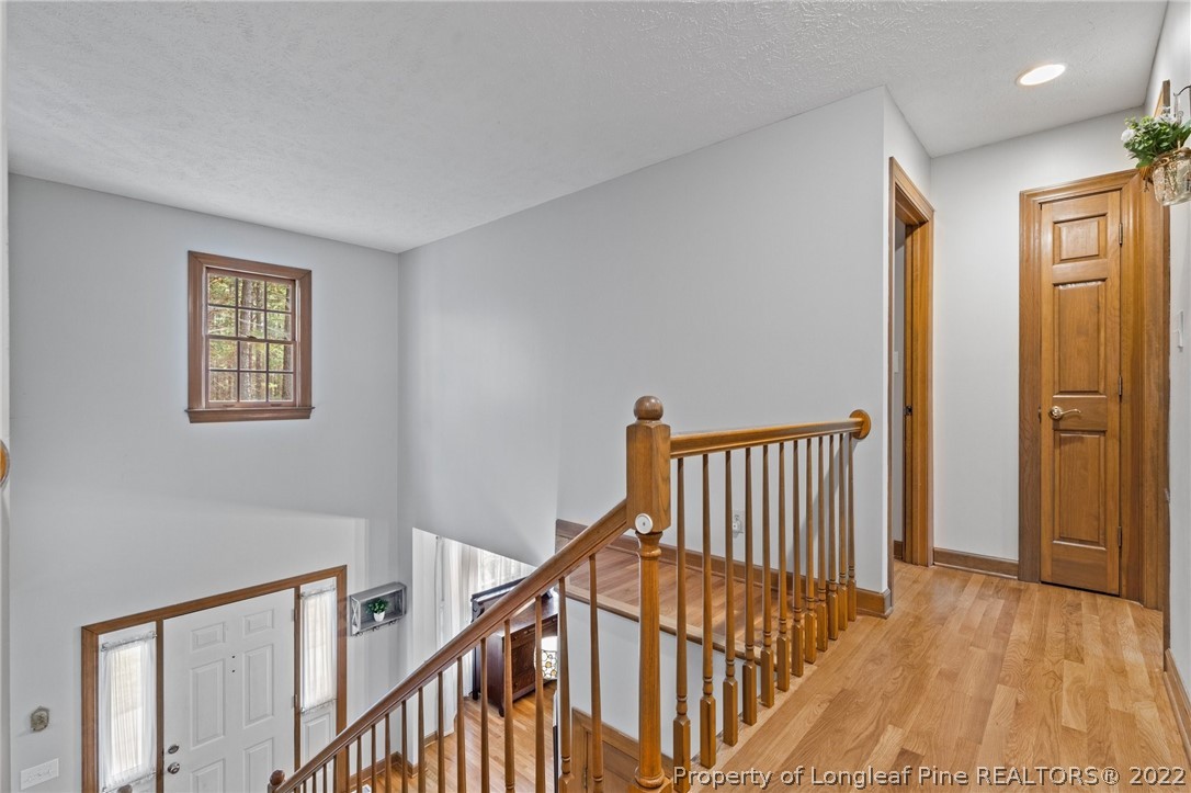 30480 East Lake Road Wagram, NC 28396 - Photo 33 of 49 a view of staircase with railing and a rug