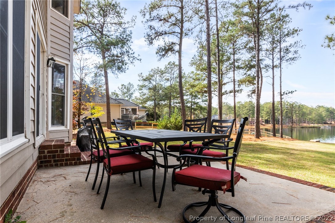 30480 East Lake Road Wagram, NC 28396 - Photo 4 of 49 a view of a chairs and table in the patio