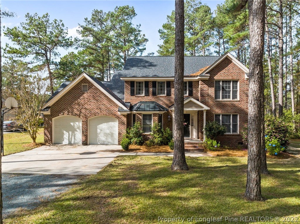 30480 East Lake Road Wagram, NC 28396 - Photo 48 of 49 a front view of a house with a yard