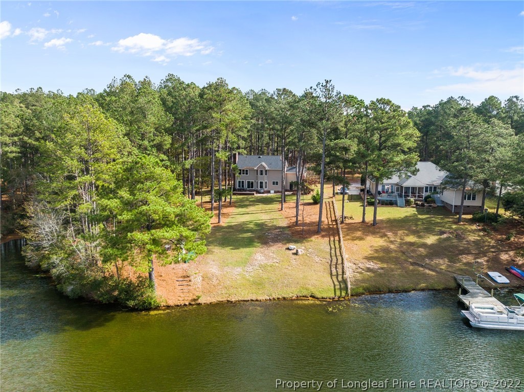 30480 East Lake Road Wagram, NC 28396 - Photo 5 of 49 a view of a lake with houses