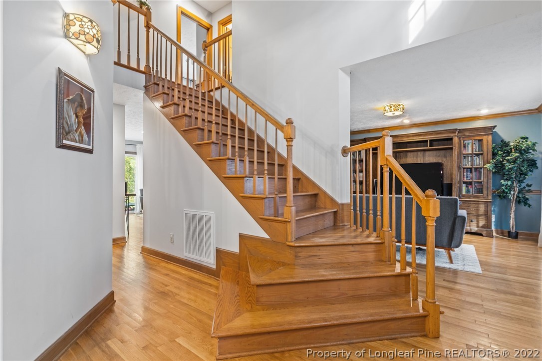 30480 East Lake Road Wagram, NC 28396 - Photo 10 of 49 a view of entryway and hall with wooden floor