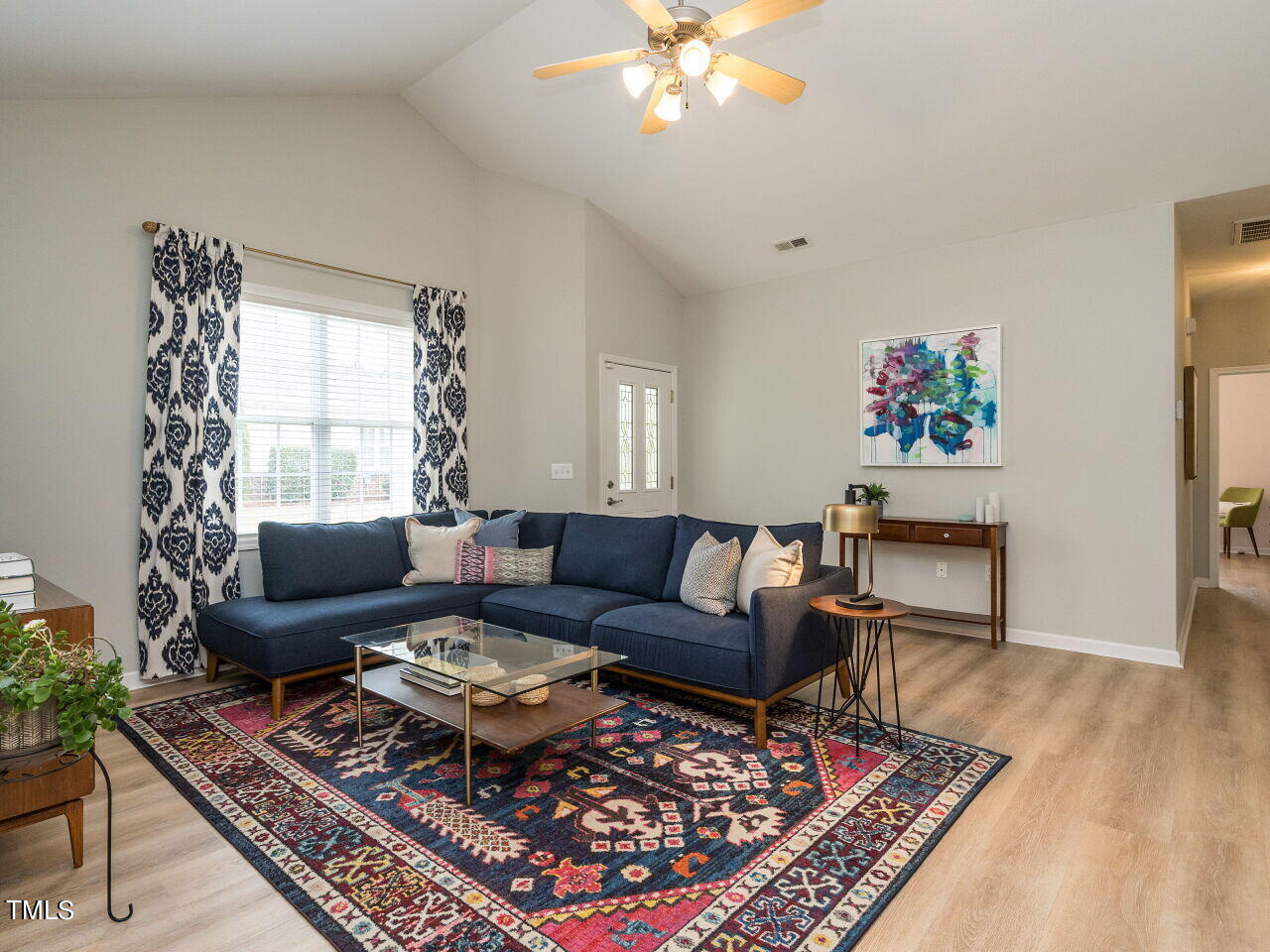 2650 Andover Glen Road Raleigh, NC 27604 - Photo 6 of 27 a living room with furniture a rug and a window