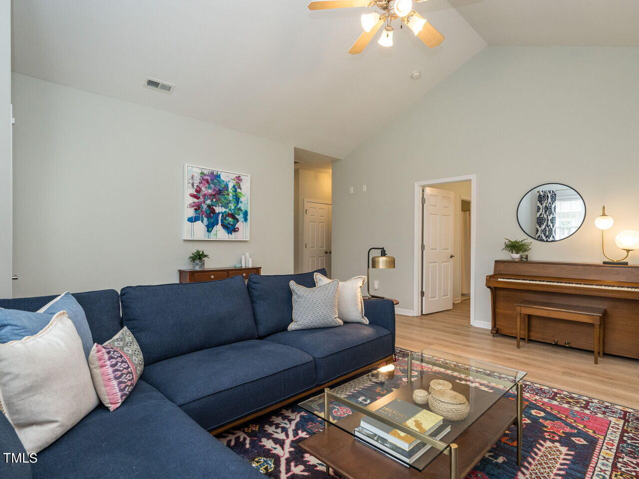 2650 Andover Glen Road Raleigh, NC 27604 - Photo 7 of 27 a living room with furniture a rug and a window