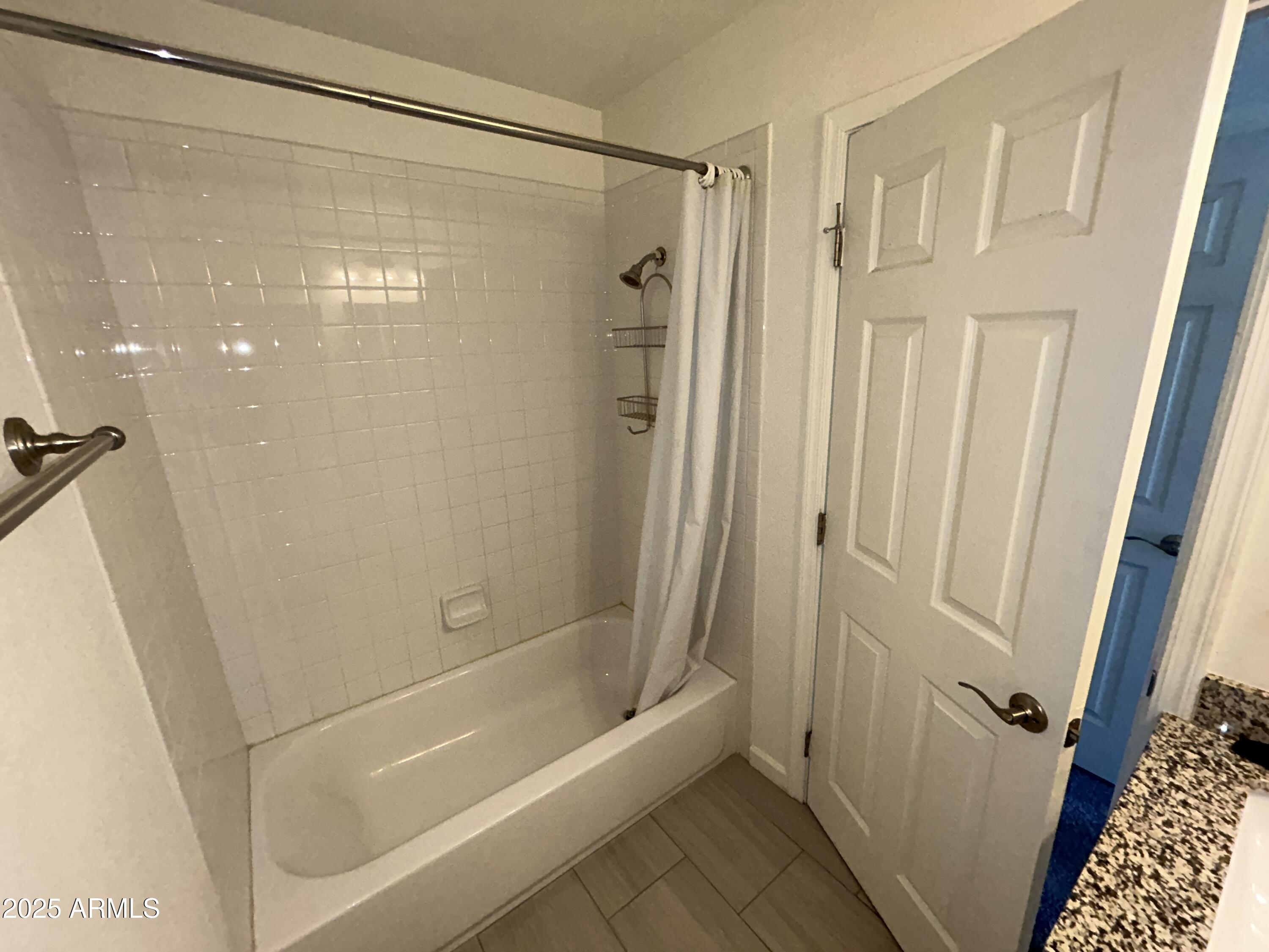 9831 South 48th Way, Unit 4 Phoenix, AZ 85044 - Photo 13 of 21 a bathroom with a shower and a bath tub