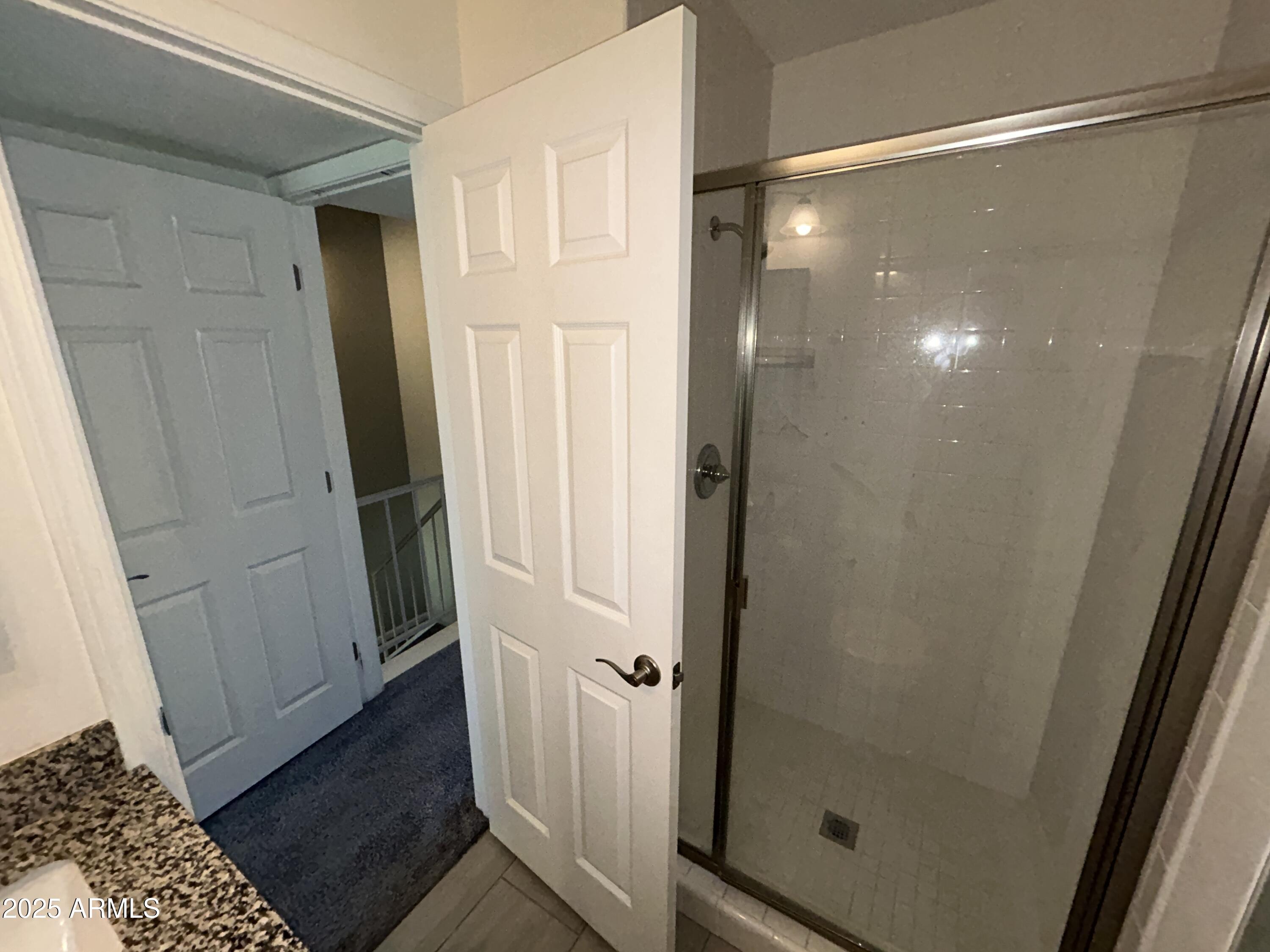 9831 South 48th Way, Unit 4 Phoenix, AZ 85044 - Photo 15 of 21 a bathroom with a glass door shower and a sink