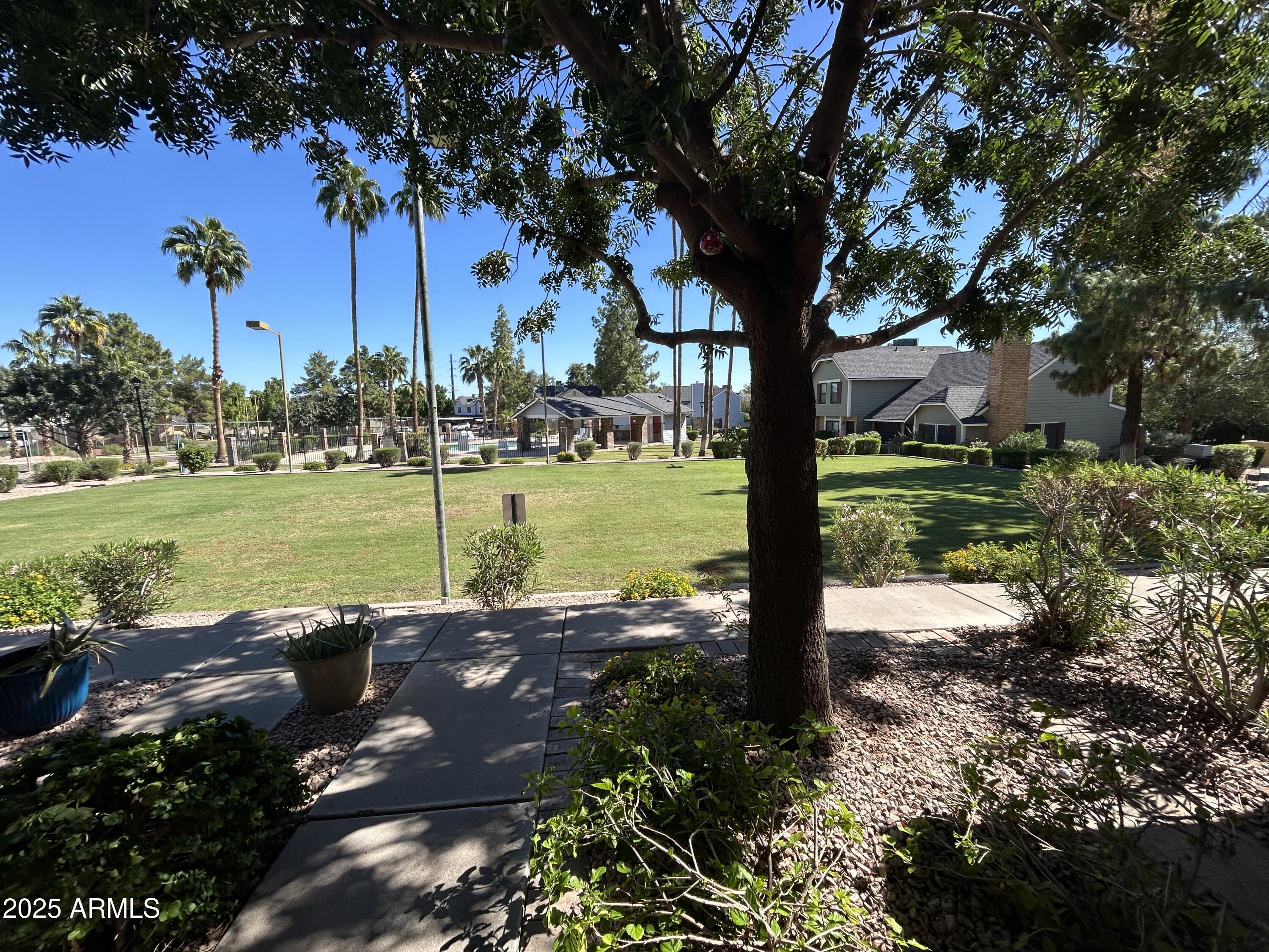 9831 South 48th Way, Unit 4 Phoenix, AZ 85044 - Photo 2 of 21 a view of a park with large trees
