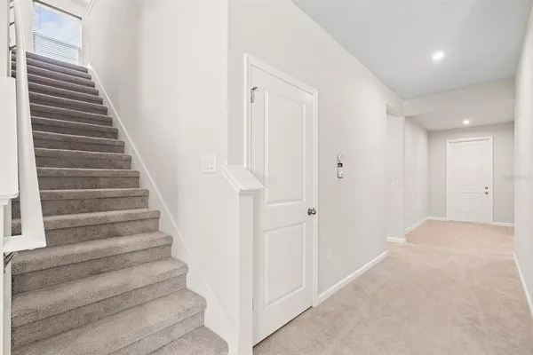 a view of entryway with wooden floor