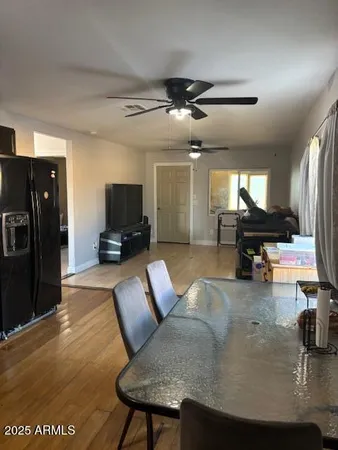 a kitchen with stainless steel appliances kitchen island granite countertop a refrigerator and a stove top oven