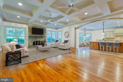 a living room with fireplace furniture and a flat screen tv