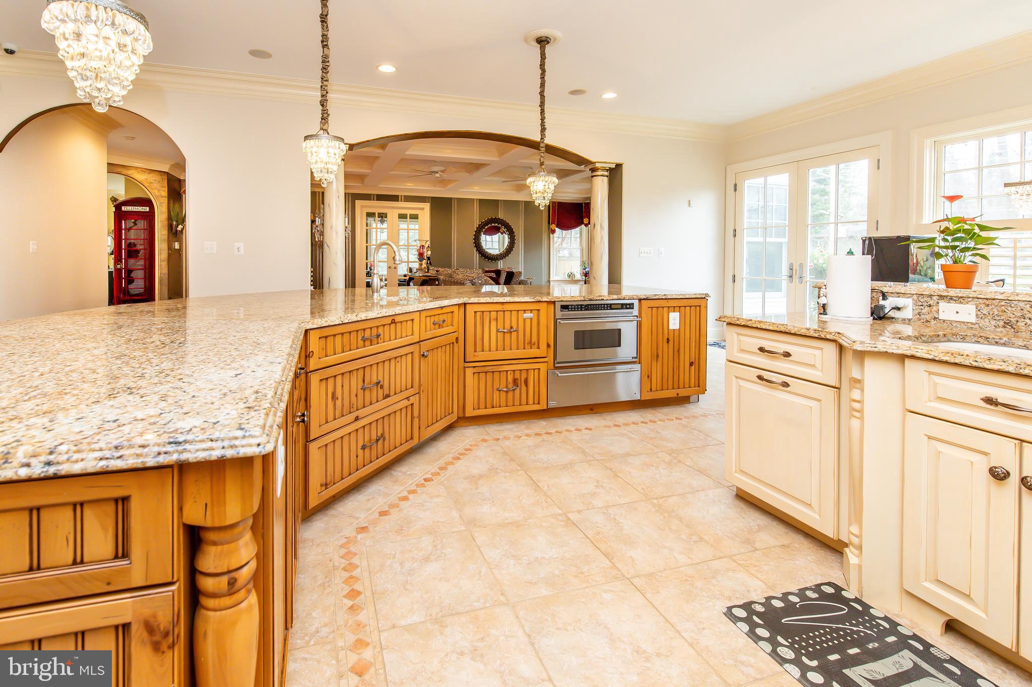 211 Norwood Road Annapolis, MD 21401 - Photo 21 of 94 a large kitchen with stainless steel appliances granite countertop a stove a sink and a refrigerator