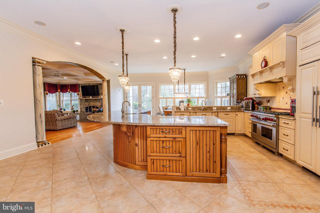 a spacious bathroom with a granite countertop sink a mirror and a