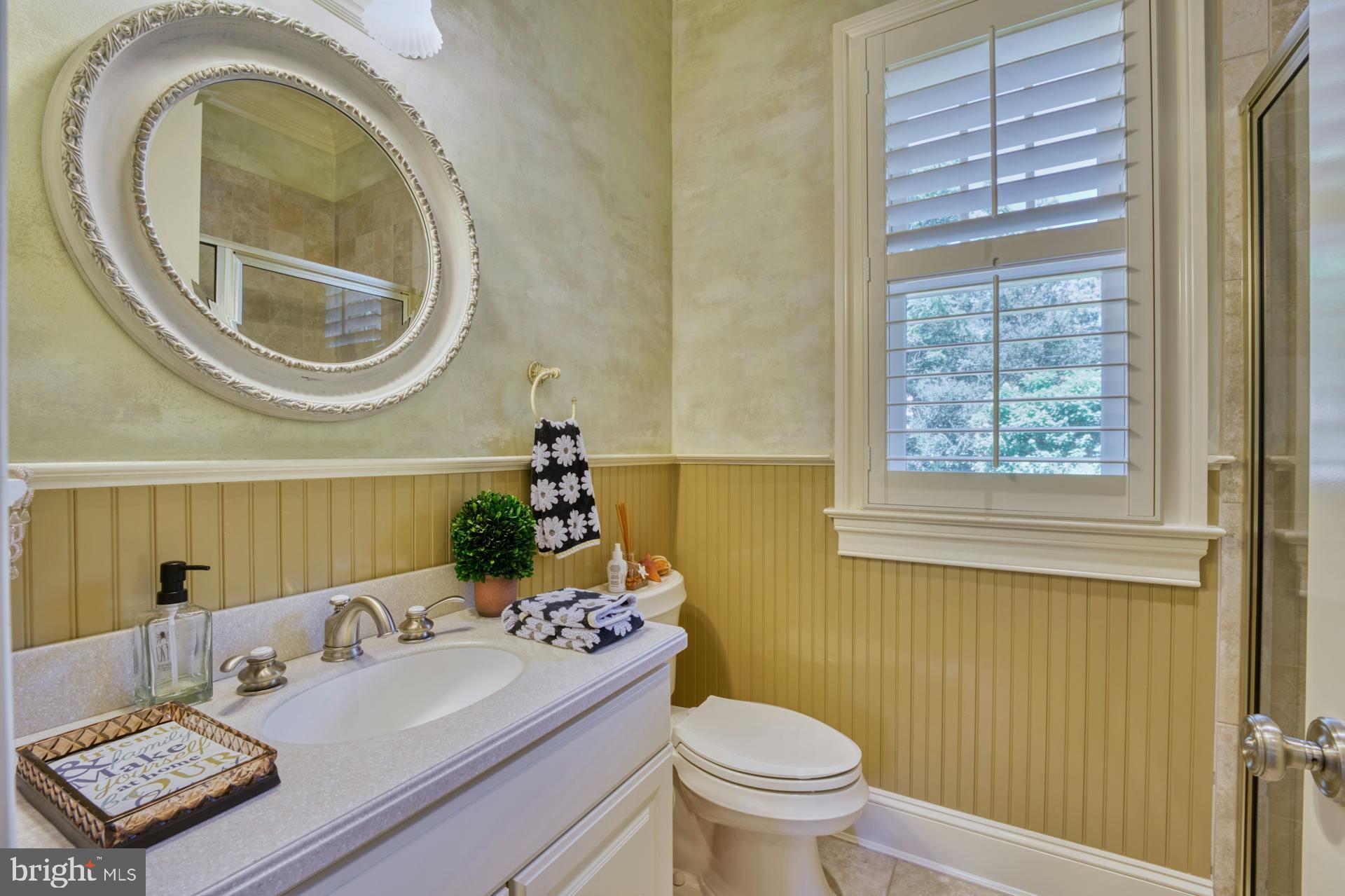 211 Norwood Road Annapolis, MD 21401 - Photo 29 of 94 a bathroom with a toilet a sink and a mirror