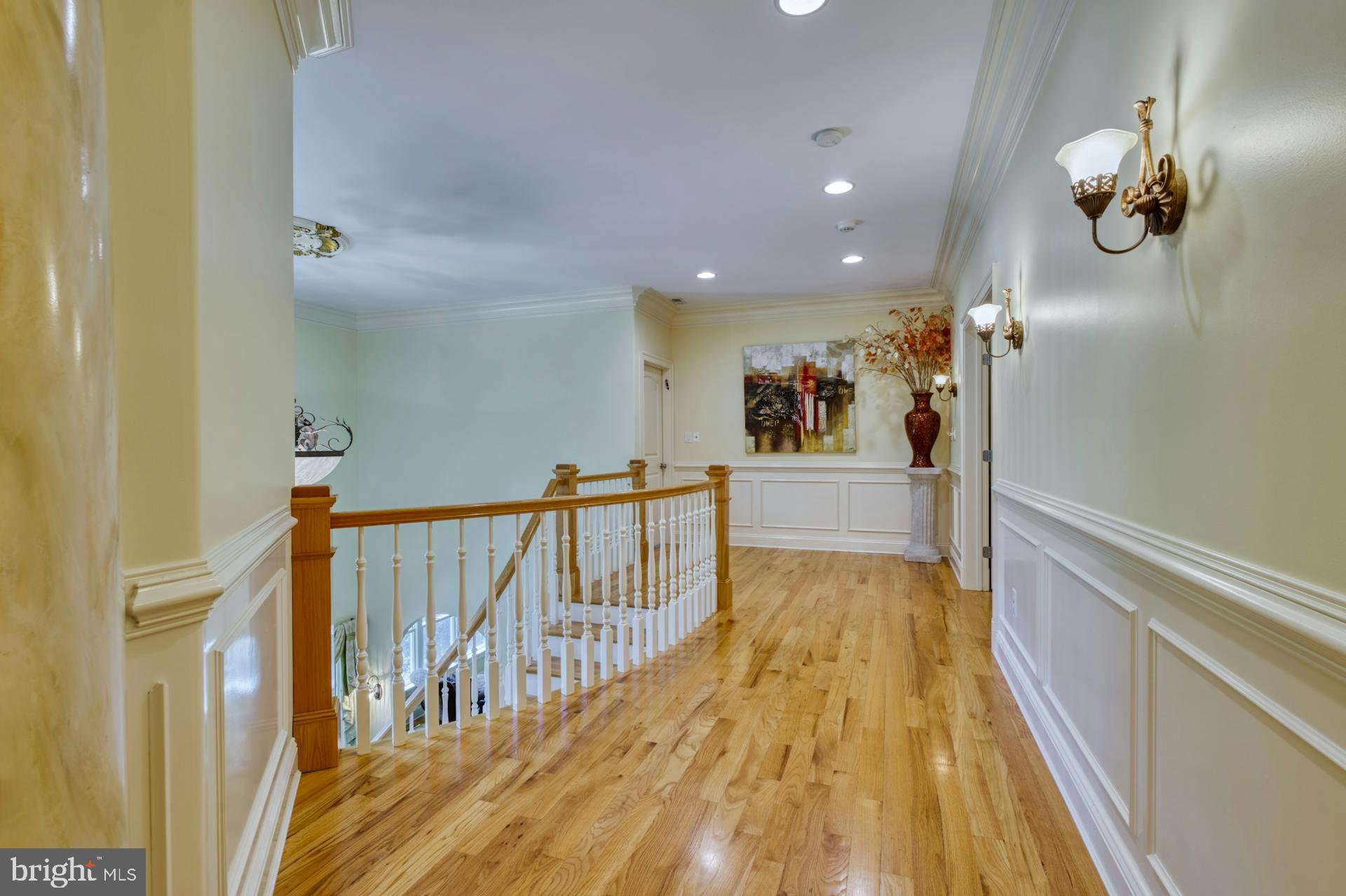 211 Norwood Road Annapolis, MD 21401 - Photo 33 of 94 a view of a hallway with wooden floor and a chandelier
