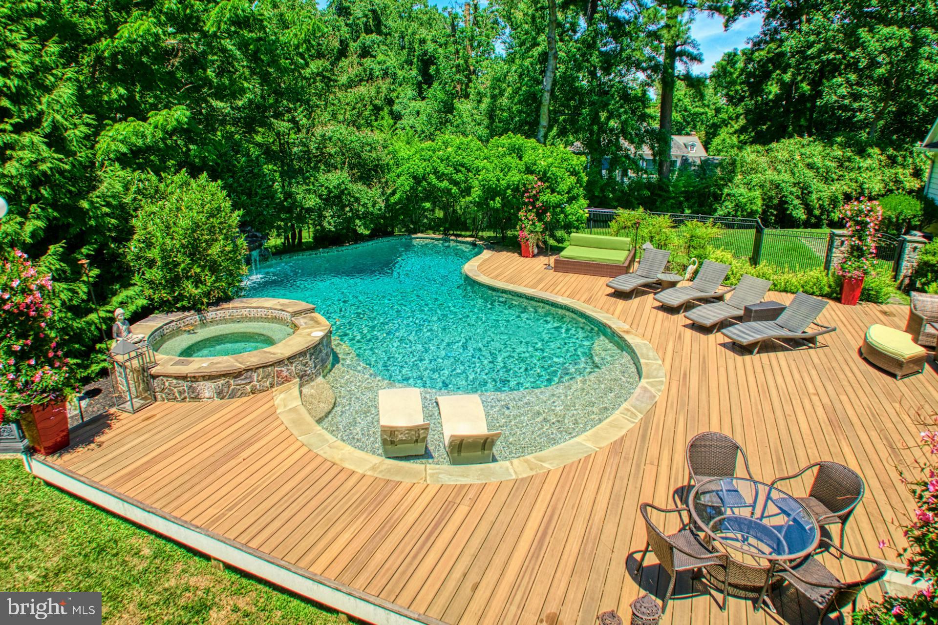 211 Norwood Road Annapolis, MD 21401 - Photo 61 of 94 a view of a swimming pool with a patio and a garden