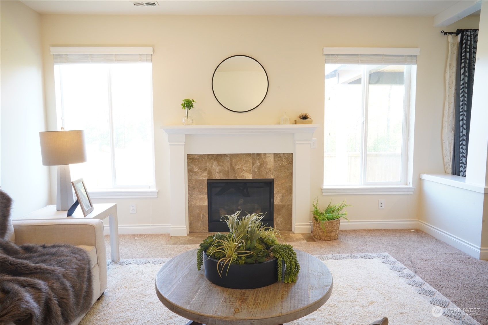 13763 173rd Place Southeast Renton, WA 98059 - Photo 18 of 40 a living room with furniture and a fireplace