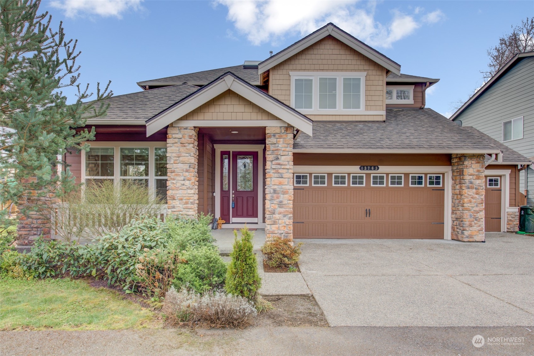 13763 173rd Place Southeast Renton, WA 98059 - Photo 2 of 40 a front view of a house with garden