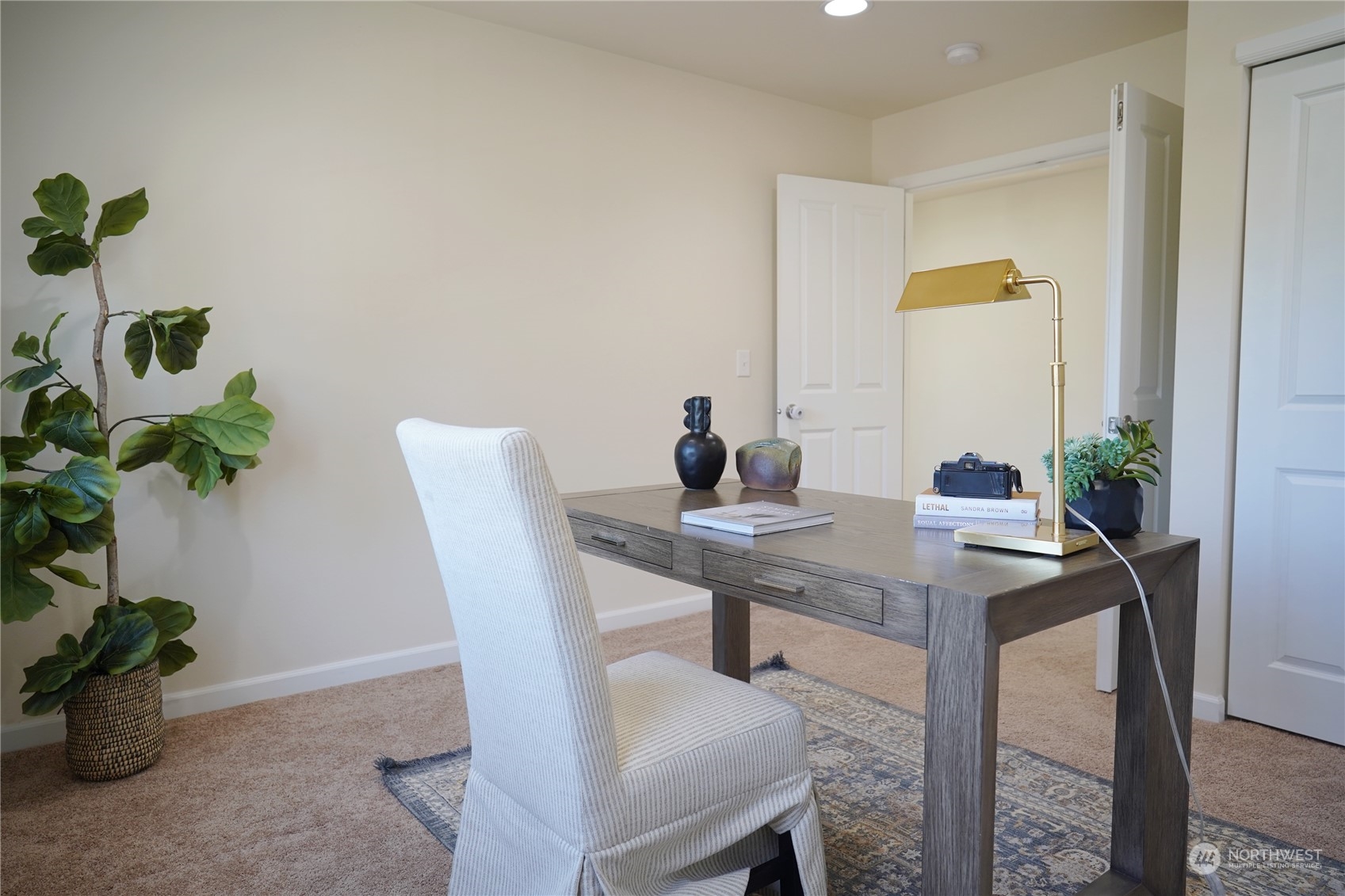 13763 173rd Place Southeast Renton, WA 98059 - Photo 21 of 40 a view of a workspace with a table and chair in a room