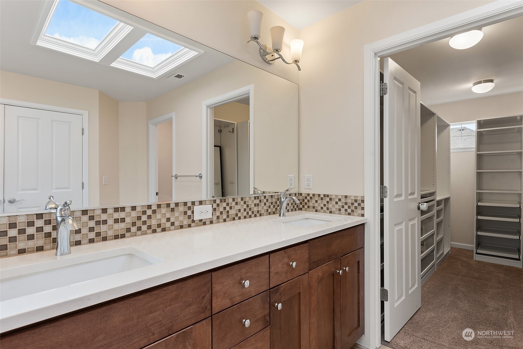 13763 173rd Place Southeast Renton, WA 98059 - Photo 25 of 40 a bathroom with a double vanity sink and mirror