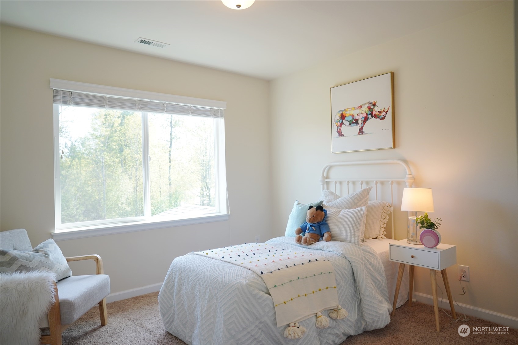 13763 173rd Place Southeast Renton, WA 98059 - Photo 27 of 40 a bedroom with a bed and a window