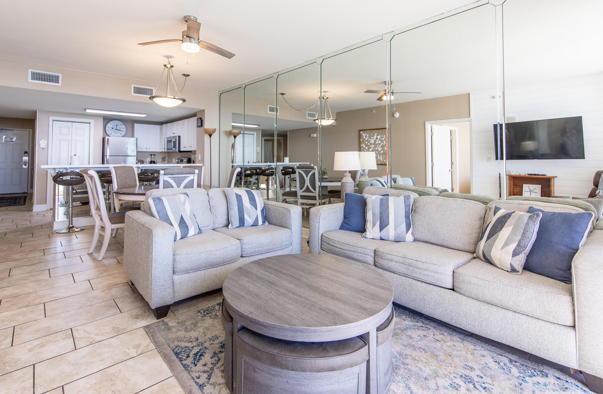 10901 Front Beach Road, Unit 2103 Panama City Beach, FL 32408 - Photo 13 of 54 a living room with furniture and a chandelier