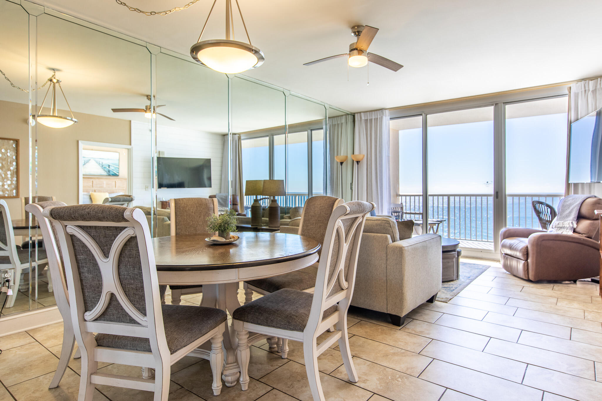 10901 Front Beach Road, Unit 2103 Panama City Beach, FL 32408 - Photo 14 of 54 a view of a dining room with furniture window and outside view