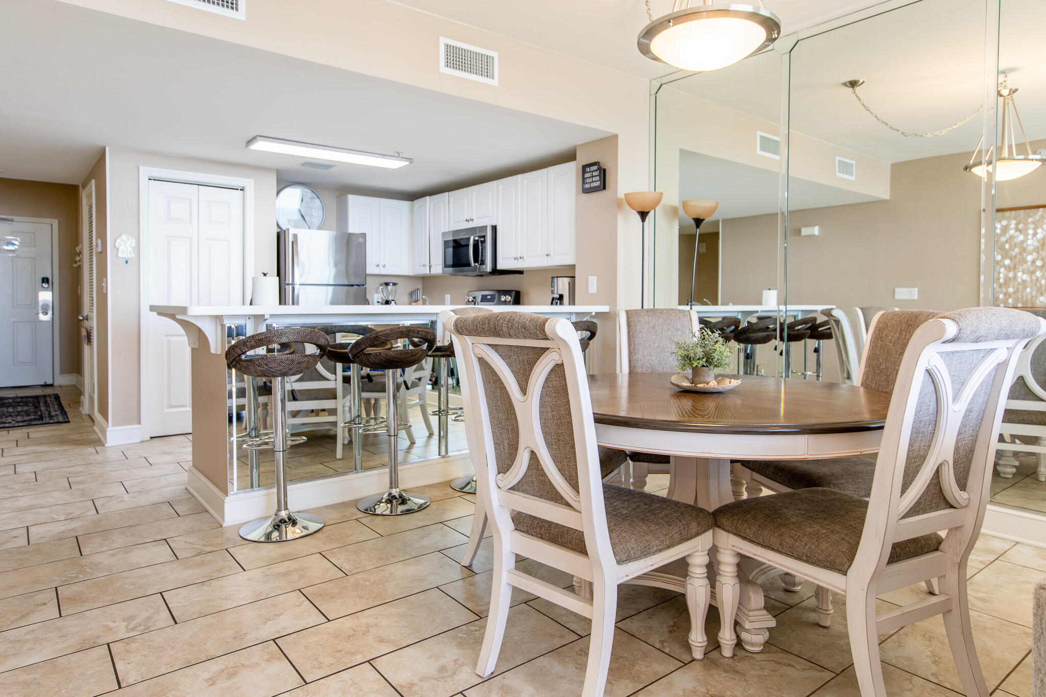 10901 Front Beach Road, Unit 2103 Panama City Beach, FL 32408 - Photo 15 of 54 a view of a dining room with furniture