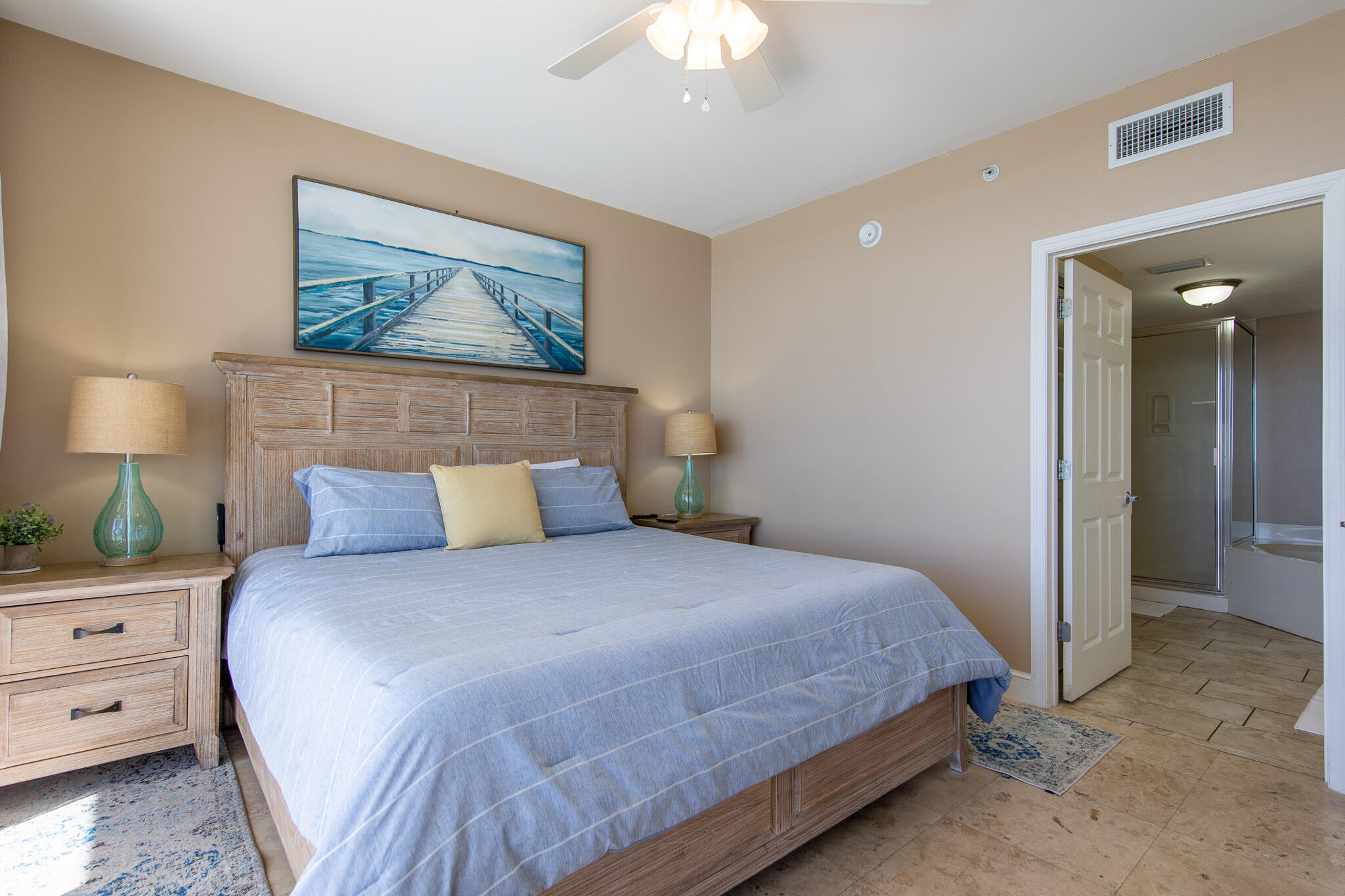 10901 Front Beach Road, Unit 2103 Panama City Beach, FL 32408 - Photo 21 of 54 a bedroom with a bed and a painting on the wall