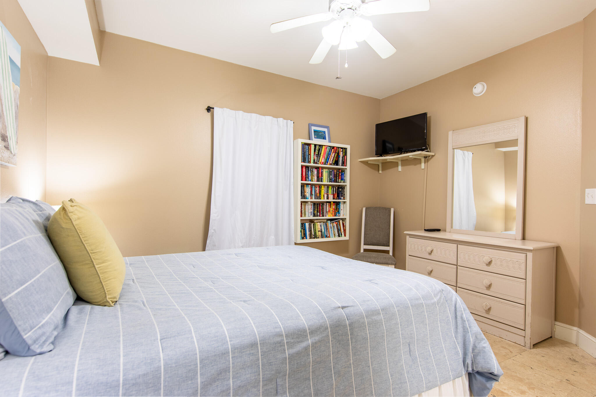10901 Front Beach Road, Unit 2103 Panama City Beach, FL 32408 - Photo 25 of 54 a bedroom with a large bed and a chandelier