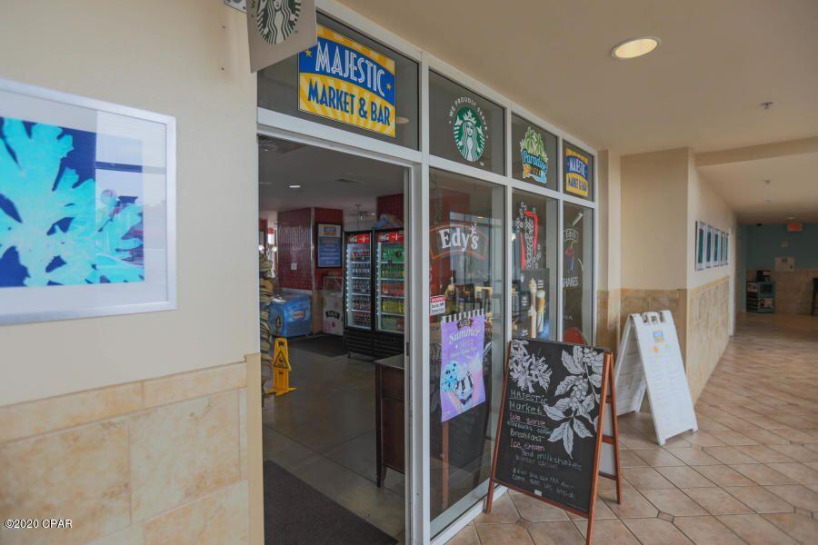 10901 Front Beach Road, Unit 2103 Panama City Beach, FL 32408 - Photo 34 of 54 a view of a room with furniture and wooden floor