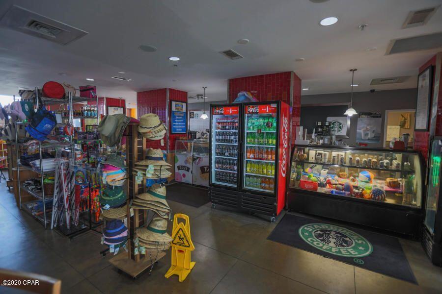 10901 Front Beach Road, Unit 2103 Panama City Beach, FL 32408 - Photo 35 of 54 a living room with couch and a flat screen tv