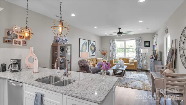 a building outdoor space with patio furniture and potted plants