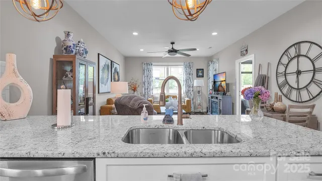 a living room with furniture and a painting